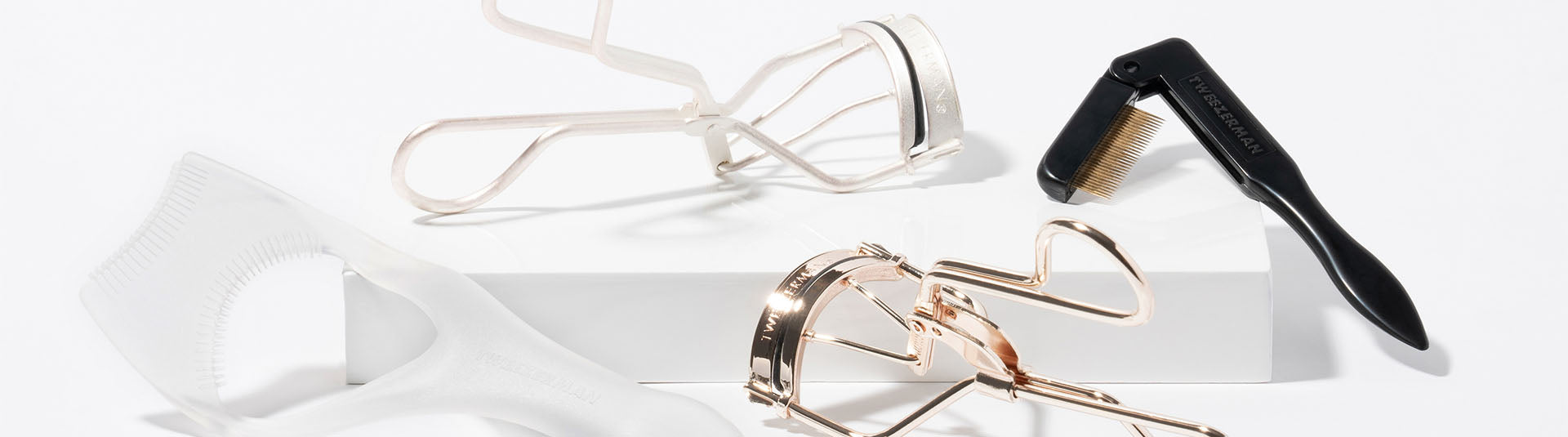 2 eyelash curler and an ilash comb