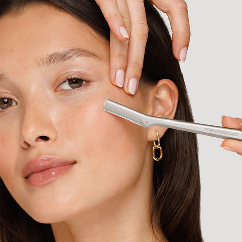 Model using stainless steel facial razor