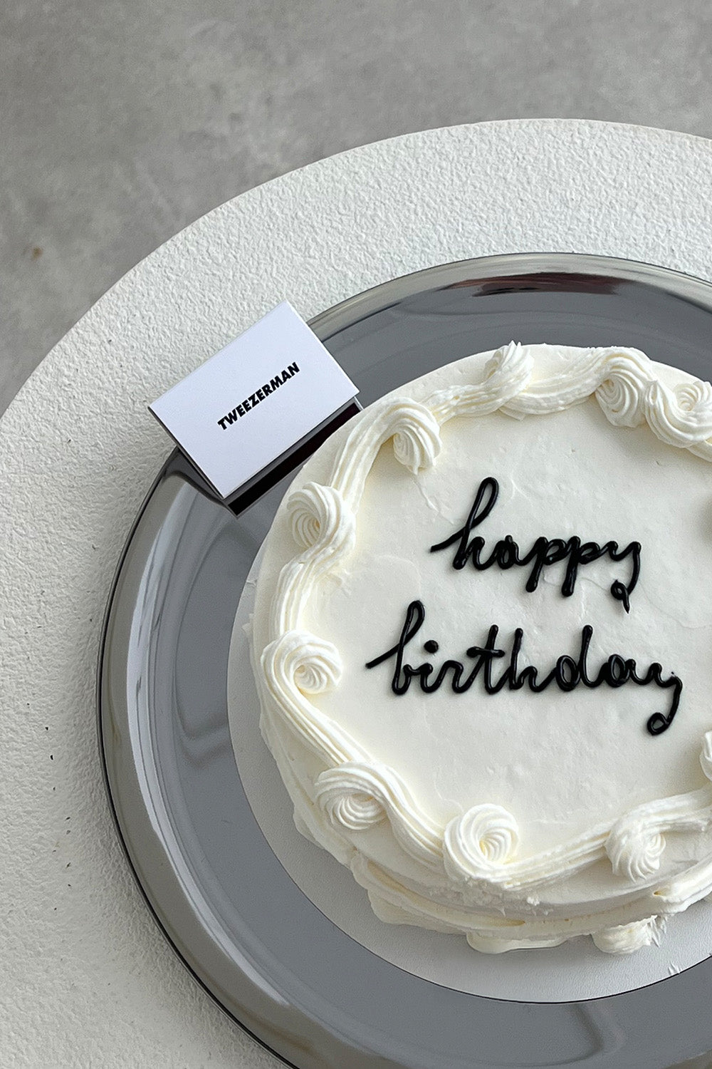Happy Birthday cake and Tweezerman logo matches