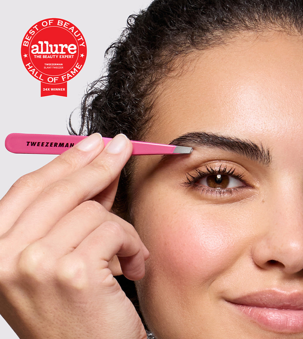 Tweezerman pink tweezer held next to the brow of a woman, with an allure winning badge