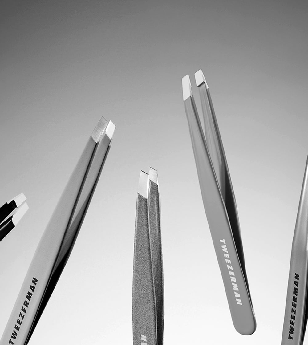 Black and White tweezers on a plain background mobile size