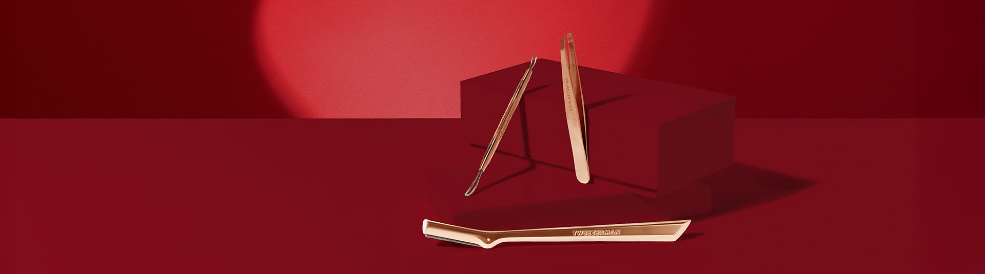 Landscape red blocks with rose gold beauty tools leaning against them