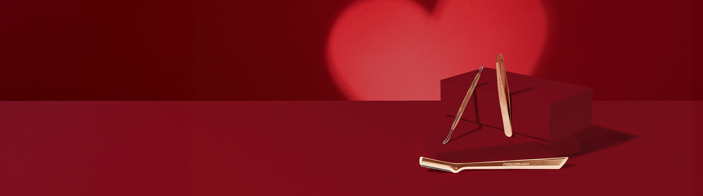 Valentine's Design with red coloured elements and a lighter red heart in the background