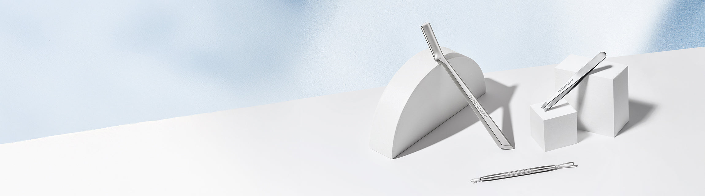 Stainless Steel Tools with a blue background - landscape image