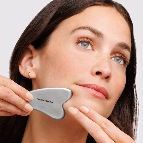 Model using Stainless Steel Gua Sha