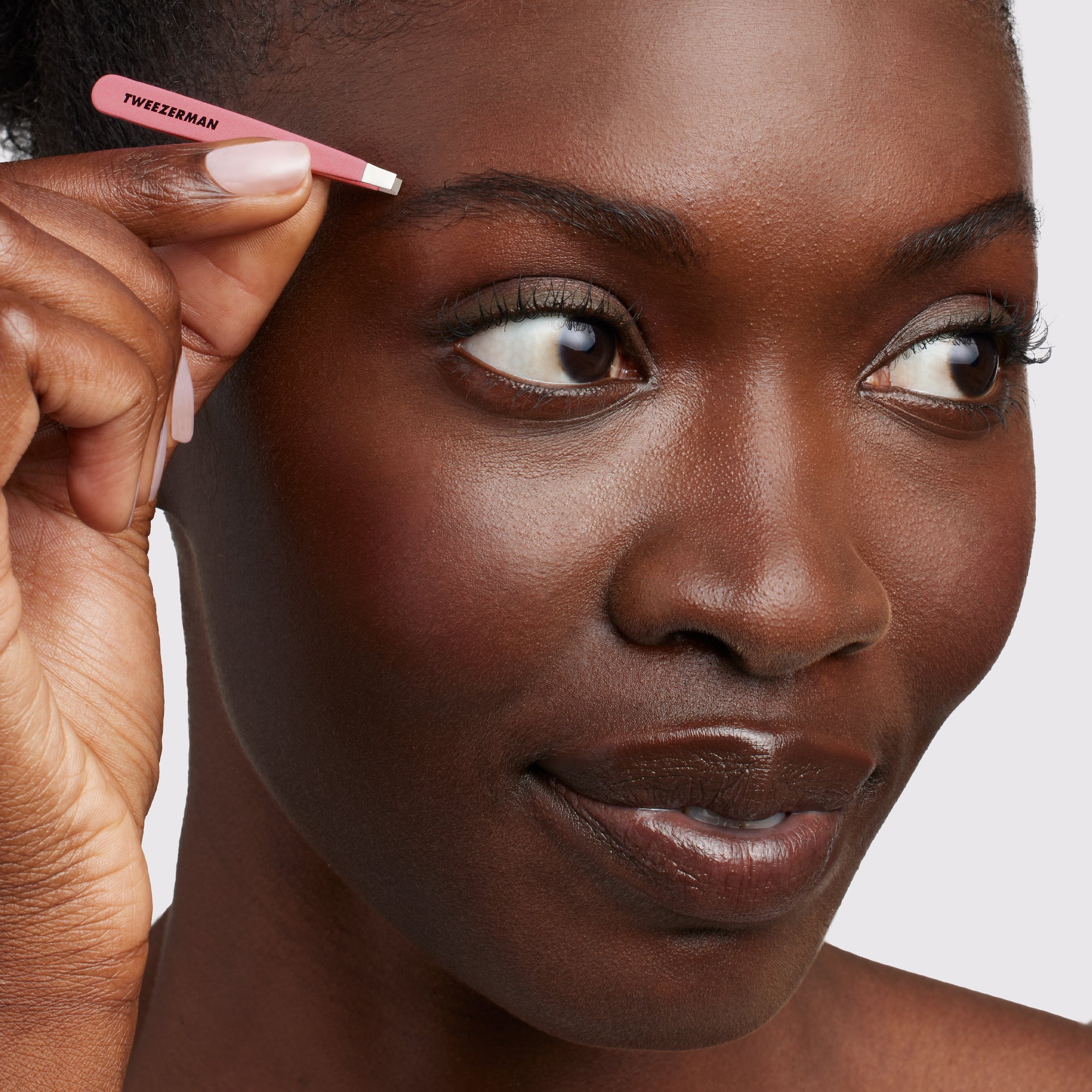 Model using pink micro mini flat tip tweezer