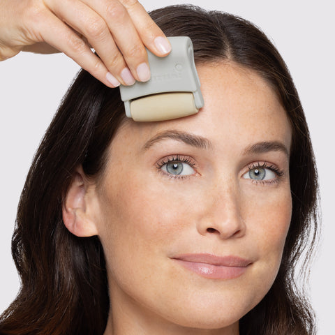 MODEL USING 3-in-1 Facial Roller Set ON FOREHEAD