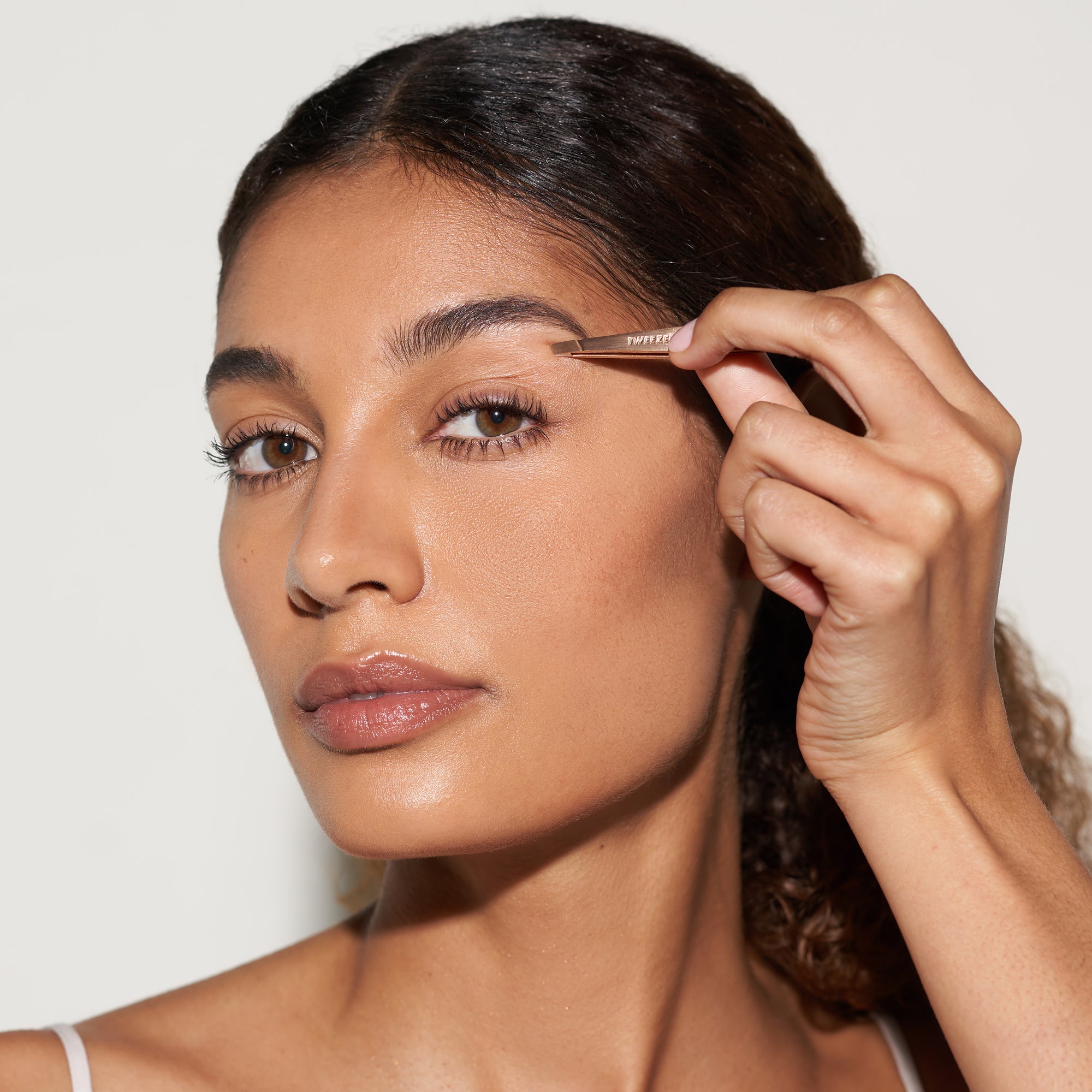 Model using Rose Gold Mini Slant Tweezer