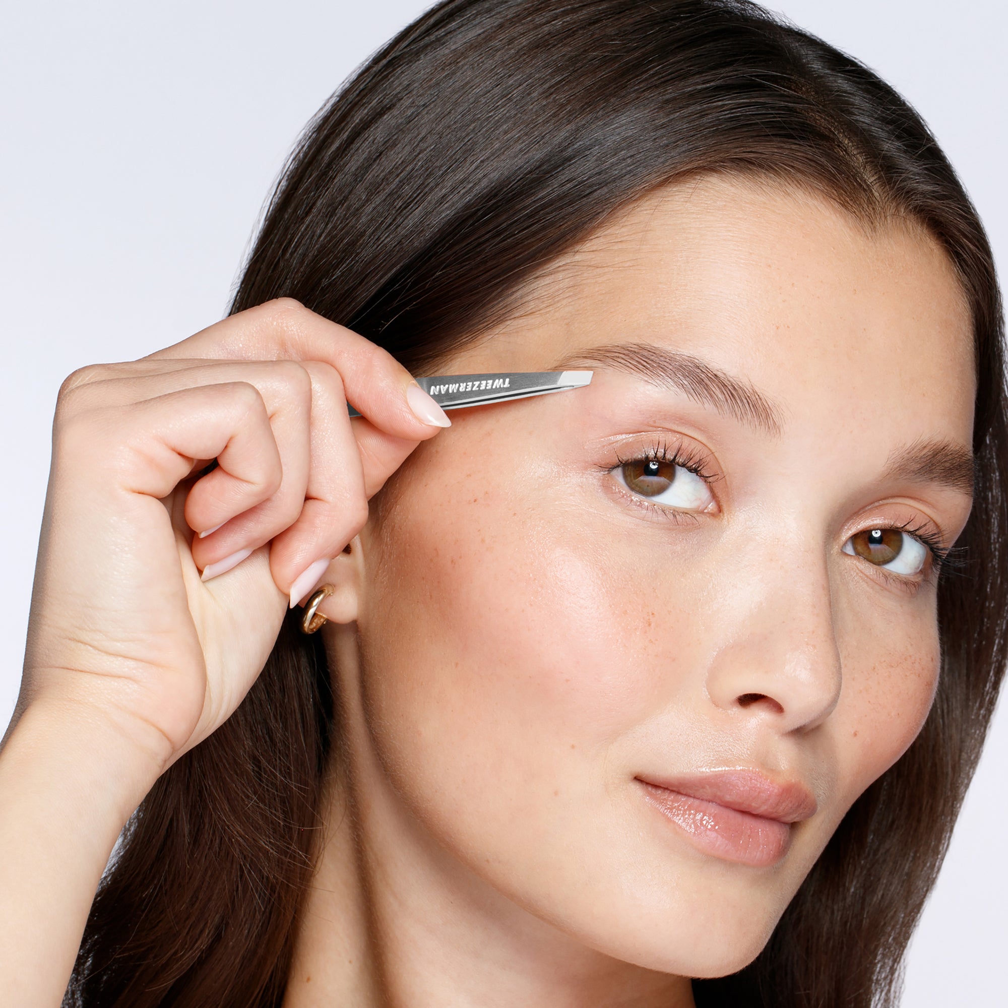 Model using classic mini slant tweezer