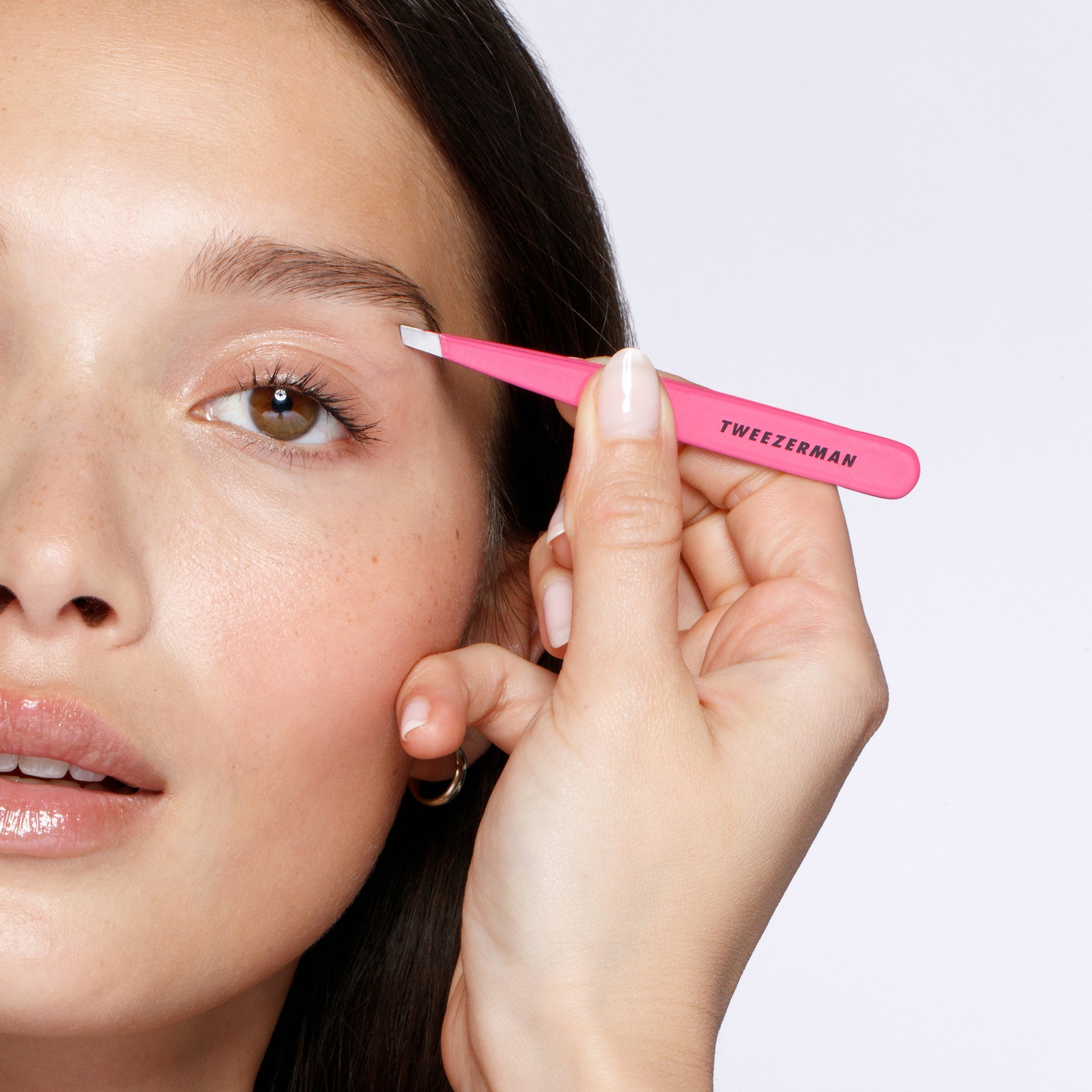 Model using Pretty in Pink Slant Tweezer