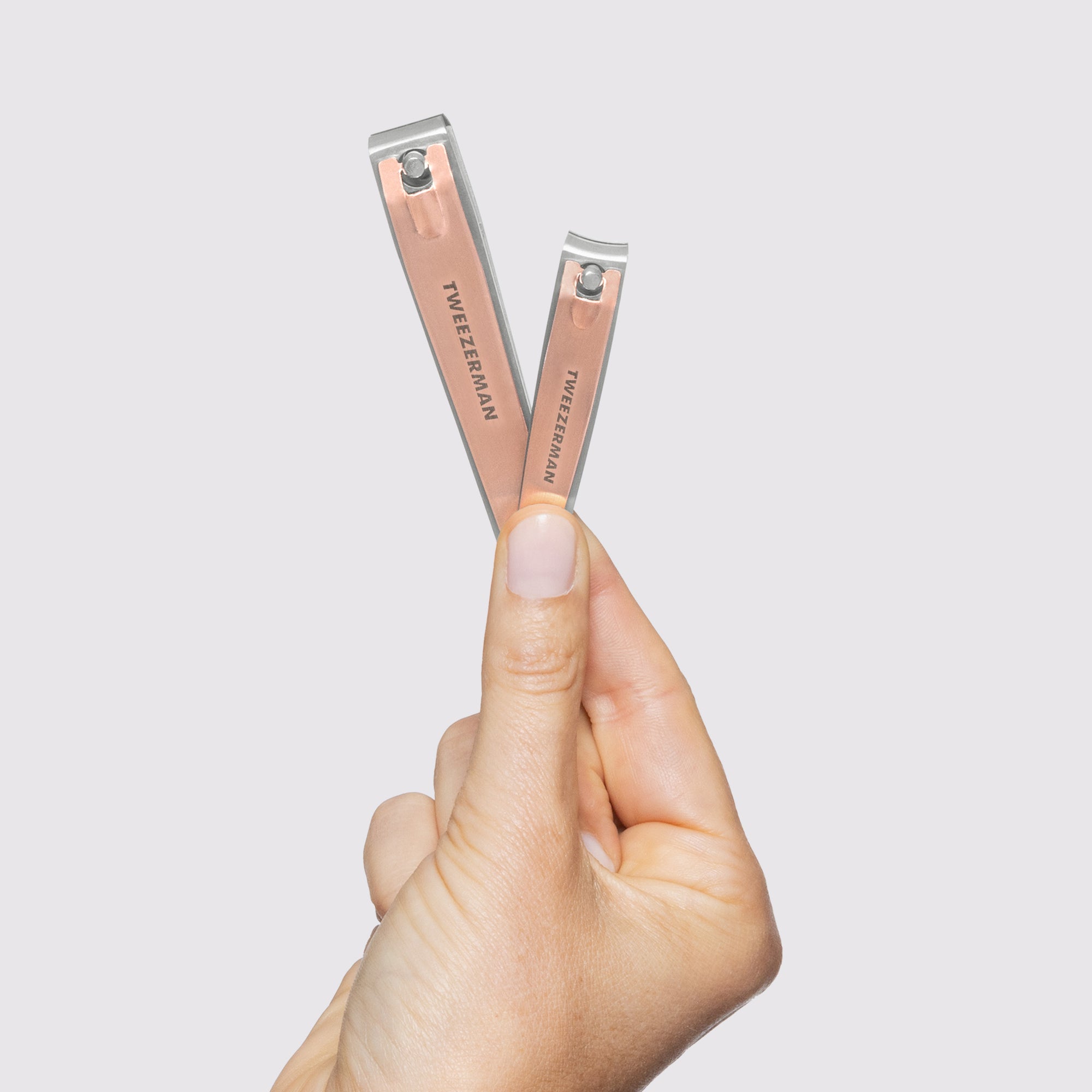 Model holding the Rose Gold Combo Clipper Set